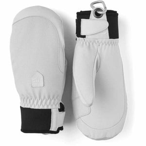 Hestra white leather mittens with black cuffs and carabiner attachment