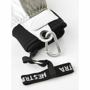 Hestra glove cuff with attached carabiner and branded wrist strap
