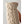 Close up of a beige cable knit wool glove with brown leather palm