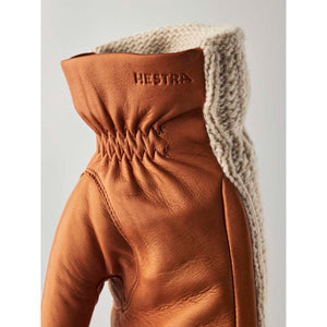 Hestra tan leather glove with a beige knitted cuff
