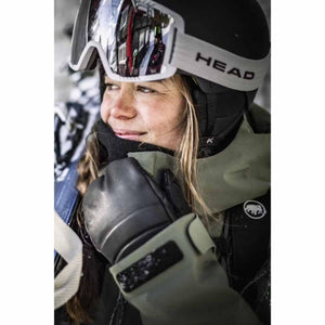 Person wearing a Head ski helmet and goggles with a Mammut jacket