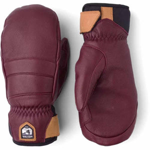 Hestra burgundy leather mittens with tan leather wrist strap and logo patch