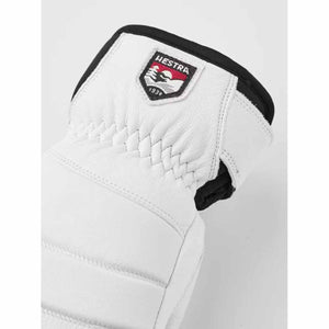 White Hestra leather glove cuff with branded patch