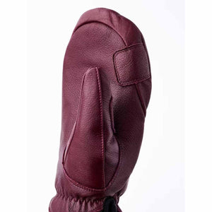 Hestra burgundy leather mitten with reinforced thumb and palm detail