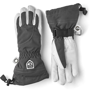 Hestra grey and white insulated winter gloves with adjustable wrist straps and drawcord cuffs