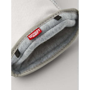 Interior of a Hestra glove showing grey fleece lining and G-Loft insulation label