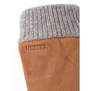 Close up of tan leather Hestra glove with grey ribbed wool cuff