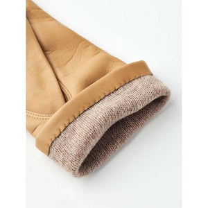 Tan leather glove cuff with ribbed knit lining