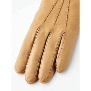 Tan leather glove with decorative stitching on the back