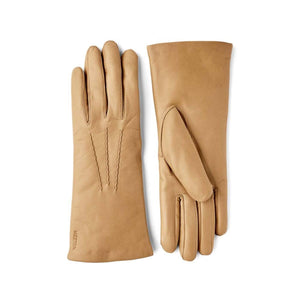 Hestra tan leather gloves with decorative stitching on the back