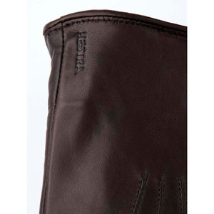 Brown leather Hestra glove cuff detail