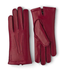 Pair of red Hestra leather gloves