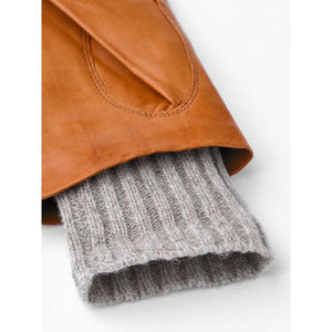 Tan leather glove cuff with grey ribbed wool lining
