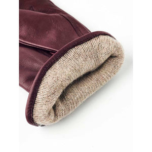 Hestra burgundy leather glove cuff with beige knit lining
