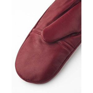 Close up of a red leather mitten