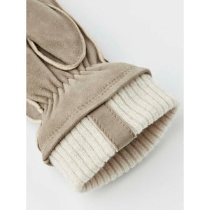 Close up of beige suede glove with ribbed knit cuff