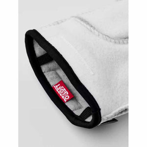 Close up of white glove cuff with black trim and red G-Loft brand label