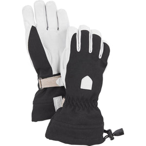 Hestra black and white ski gloves with adjustable wrist strap and drawstring cuff