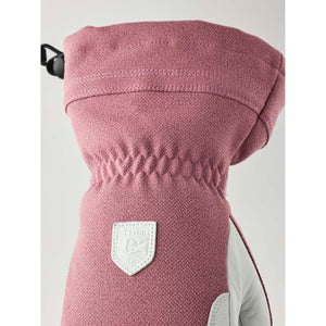 Hestra pink and grey winter glove with elastic wrist and brand logo patch