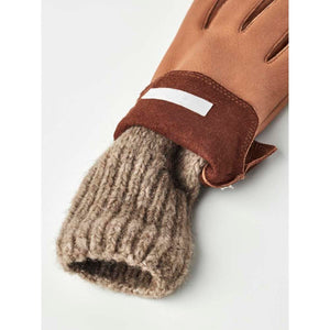 Hestra tan leather glove with a brown suede cuff and a ribbed wool lining