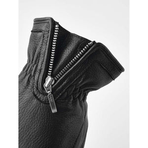 Close up of black Hestra leather glove cuff with silver zipper detail