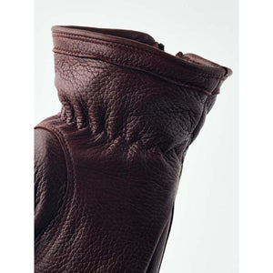 Close up of a brown Hestra leather glove cuff