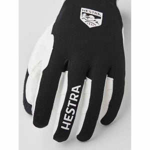 Hestra black and white glove with brand logo on the back and finger