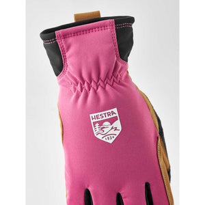 Pink and black Hestra glove with tan leather palm detail