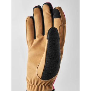 Tan and pink winter glove with black fleece palm patch