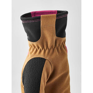 Tan suede and black fabric glove cuff with pink trim