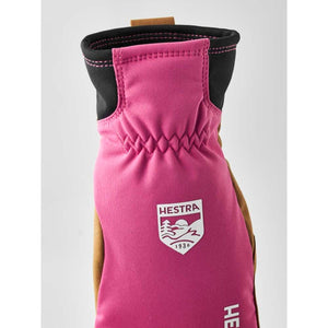 Hestra pink and brown glove with elastic wrist and brand logo patch
