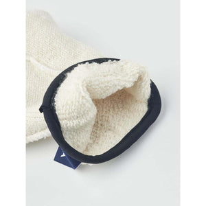 Interior view of a Hestra cream wool glove with black trim
