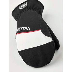 Black and white Hestra ski mitten with red trim