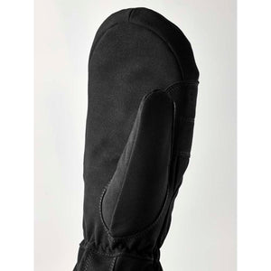 Black Hestra mitten against a white background