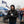 Man wearing ActionHeat black jacket and Chicago Bears beanie holding a coffee cup at a tailgate