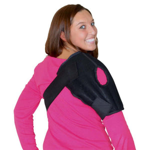 Woman wearing a black Polar Products shoulder ice wrap over a pink long sleeve shirt