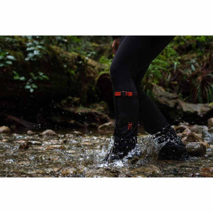 Hillsound gaiters worn on legs while walking through a shallow stream
