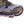 Hillsound traction device attached to the front of a hiking boot