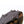 Hillsound traction device with metal spikes attached to a hiking boot sole