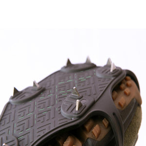 Hillsound traction device with metal spikes attached to a hiking boot sole