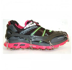 Mammut traction spikes attached to a black and pink running shoe