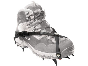 The North Face hiking boot with black traction spikes attached to the sole