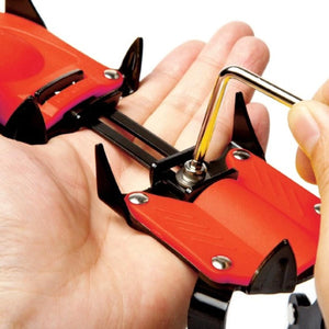 Hand using an allen key to adjust a red and black crampon