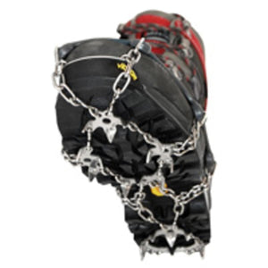 Metal traction spikes attached to the sole of a hiking boot