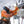Utility worker in high visibility gear and hard hat working on equipment during a snowstorm