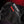 Close up of black Hotronic glove with white brand logo and red accent