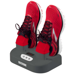 Hotronic shoe dryer with red running shoes placed on the heating nozzles
