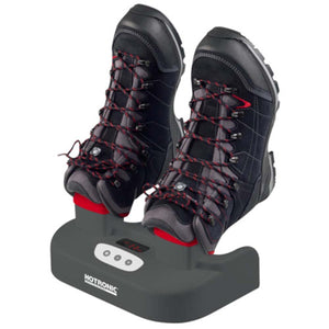 Hotronic boot dryer with two hiking boots placed on the heating nozzles