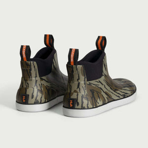 Huk camo print ankle boots with orange pull tabs and white soles