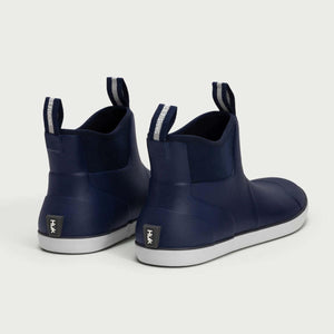 Huk navy blue ankle boots with white soles and pull tabs